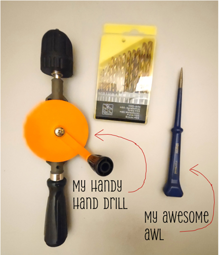 Manual hand drill, drill bit set, and awl used for hanging wall art without power tools, ideal for precise, damage-free picture hanging on various wall types.